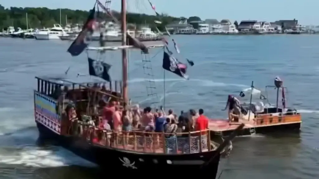 Sea Gypsy II pirate ship firing water cannons on the Metedeconk River at Waterfront Marina in Brick, NJ